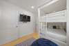 BUNK ROOM W/ WALL MOUNTED FLATSCREEN SMART TV