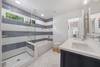 LARGE HALL FULL BATH WITH DUAL VANITIES, TUB AND SHOWER LARGE HALL FULL BATH WITH DUAL VANITIES, TUB AND SHOWER