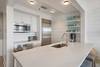 GENEROUS ISLAND FEATURING BAR TOP SEATING FOR 3 GENEROUS ISLAND FEATURING BAR TOP SEATING FOR 3