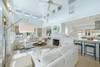 LIVING AREA W/ FRENCH DOORS TO WRAPAROUND PORCH LIVING AREA W/ FRENCH DOORS TO WRAPAROUND PORCH