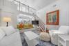 LIVING ROOM OFF ENTRANCE W/BAY WINDOW SEAT & MOUNTED TV LIVING ROOM OFF ENTRANCE W/BAY WINDOW SEAT & MOUNTED TV
