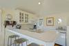 KITCHEN WITH BARTOP SEATING FOR THREE PEOPLE KITCHEN WITH BARTOP SEATING FOR THREE PEOPLE