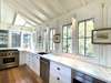 WALL OF WINDOWS W/NATURAL LIGHT