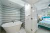 LARGE BATH TUB AREA WITH PRIVACY DOORS LARGE BATH TUB AREA WITH PRIVACY DOORS