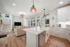 MODERN, COASTAL KITCHEN FACING LIVING, ALL STAINLESS STEEL APPLI