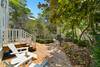 LARGE WOODED DECK; ADIRONDACK SEATING FOR TWO LARGE WOODED DECK; ADIRONDACK SEATING FOR TWO