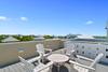 ADIRONDACK SEATING FOR FOUR ON THE ROOFTOP DECK ADIRONDACK SEATING FOR FOUR ON THE ROOFTOP DECK