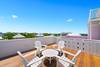 ADIRONDACK SEATING FOR FOUR ON THE ROOFTOP DECK ADIRONDACK SEATING FOR FOUR ON THE ROOFTOP DECK