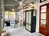 REAR SCREENED FURNISHED PORCH OFF OF THE LIVING AREA