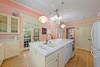 KITCHEN HAS VIEWS TO LARGE PORCH & WEST END POOL KITCHEN HAS VIEWS TO LARGE PORCH & WEST END POOL
