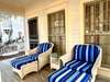 CHARMING FRONT PORCH W/CHAISE LOUNGERS FOR TWO