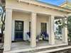 PRIVATE, FURNISHED FRONT PORCH WITH CUSHIONED SEATING