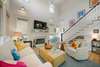LIVING W/LARGE SOFA AND TWO CLUB CHAIRS & FIREPLACE