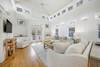 TWO LARGE SOFAS, LARGE MOUNTED FLAT SCREEN TV TWO LARGE SOFAS, LARGE MOUNTED FLAT SCREEN TV
