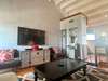 LIVING WITH FLATSCREEN TV AND SEATING FOR ALL
