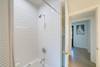 ALTERNATE VIEW OF FULL HALL BATHROOM WITH SINGLE VANITY AND SHOW ALTERNATE VIEW OF FULL HALL BATHROOM WITH SINGLE VANITY AND SHOW