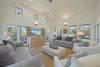OPEN LIVING WITH FLATSCREEN, SLIPCOVER SOFAS, AND CHAIRS OPEN LIVING WITH FLATSCREEN, SLIPCOVER SOFAS, AND CHAIRS