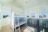 TOWER ROOM WITH SINGLE TOILET HIDDEN BEHIND BUNKS TOWER ROOM WITH SINGLE TOILET HIDDEN BEHIND BUNKS