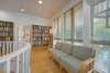 SEATING AREA IN SECOND LEVEL HALLWAY & LIBRARY