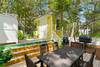 OUTDOOR DINING AREA AND CHARCOAL GRILL OUTDOOR DINING AREA AND CHARCOAL GRILL