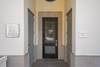 ENTRY DOOR VIEW, UNIT C TO LOBBY AND ELEVATOR ENTRY DOOR VIEW, UNIT C TO LOBBY AND ELEVATOR