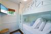 BUNK ROOM WITH FLATSCREEN TV & BUILT IN STORAGE BUNK ROOM WITH FLATSCREEN TV & BUILT IN STORAGE