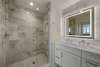 MARBLE VANITY, GLASS ENCLOSED SHOWER, & LIGHTED MIRROR