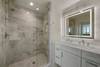 MARBLE VANITY, GLASS ENCLOSED SHOWER, & LIGHTED MIRROR MARBLE VANITY, GLASS ENCLOSED SHOWER, & LIGHTED MIRROR