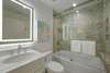 SHARED HALL FULL BATH, TUB/COMBO SHOWER, LIGHTED MIRROR
