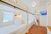 FIRST FLOOR - BUNK ROOM 1 WITH 4 TWINS AND FLATSCREEN TV FIRST FLOOR - BUNK ROOM 1 WITH 4 TWINS AND FLATSCREEN TV