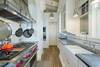 THIRD FLOOR - KITCHEN WITH STAINLESS APPLIANCES THIRD FLOOR - KITCHEN WITH STAINLESS APPLIANCES