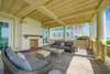 SECOND LEVEL BALCONY WITH COMFORTABLE SOFA SEATING