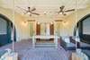 FRONT PORCH WITH BED SWINGS AND CEILING FANS