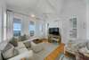 OPEN LIVING AREA ON SECOND LEVEL WITH BALCONY ACCESS