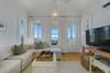 LIVING WITH FLATSCREEN, SEATING, AND GULF VIEWS