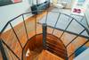 SPIRAL STAIRCASE LEADS TO SECOND FLOOR LIVING AREAS SPIRAL STAIRCASE LEADS TO SECOND FLOOR LIVING AREAS