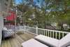 DECK ALTERNATE VIEW WITH LOUNGE SEATING AND SHADE