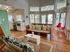 OPEN, AIRY LIVING WITH HIGH CEILINGS AND SEATING FOR ALL OPEN, AIRY LIVING WITH HIGH CEILINGS AND SEATING FOR ALL