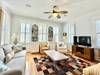 OPEN LIVING TO LEFT OF ENTRY WITH SEATING AND FLATSCREEN OPEN LIVING TO LEFT OF ENTRY WITH SEATING AND FLATSCREEN