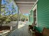 OPEN PORCH ALTERNATE VIEW FACING STAIRS BY PARKING OPEN PORCH ALTERNATE VIEW FACING STAIRS BY PARKING
