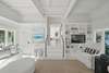 SECONDARY LIVING OFF ENTRANCE WITH FLATSCREEN TV