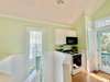 KITCHEN VIEW TO FOUR BURNER STOVE/OVEN & MICROWAVE