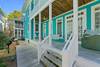 VIEW OF PORCH AND SIDE YARD, REAR GUEST COTTAGE IN BACK VIEW OF PORCH AND SIDE YARD, REAR GUEST COTTAGE IN BACK