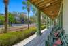EXPANSIVE OPEN PORCHES LENGTH OF HOME, UP & DOWN