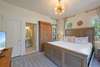 FIRST BEDROOM DOWN, PRIMARY KING W/ENSUITE BATH