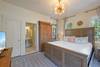 FIRST BEDROOM DOWN, PRIMARY KING W/ENSUITE BATH FIRST BEDROOM DOWN, PRIMARY KING W/ENSUITE BATH