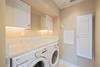 SEPARATE LAUNDRY ROOM WITH WALL MOUNTED IRONING BOARD SEPARATE LAUNDRY ROOM WITH WALL MOUNTED IRONING BOARD
