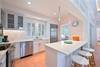 COUNTER SEATING FOR THREE BETWEEN LIVING AND KITCHEN AREAS COUNTER SEATING FOR THREE BETWEEN LIVING AND KITCHEN AREAS