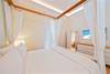 TIE-BACK SHEER BED CURTAINS ADD CARIBBEAN CHARM TIE-BACK SHEER BED CURTAINS ADD CARIBBEAN CHARM