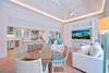 LIVING AREA OPENS TO ADJACENT KITCHEN AND DINING LIVING AREA OPENS TO ADJACENT KITCHEN AND DINING
